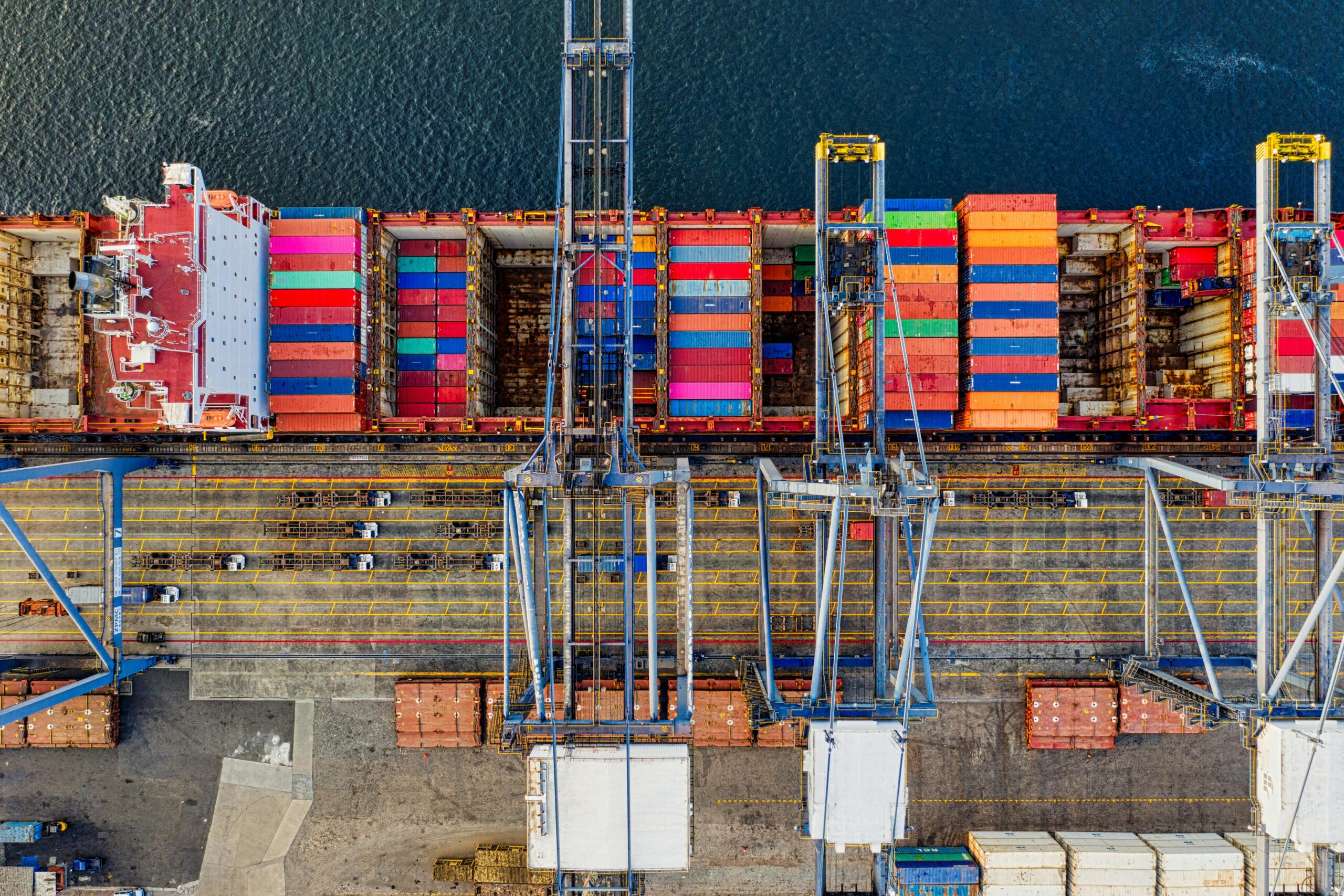 Illustrative aerial view of a container ship at a cargo terminal